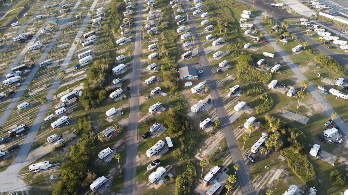 An aerial view of a lot densely packed with RVs and trailers.