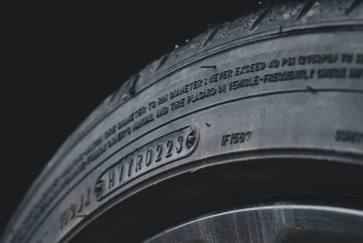 A close-up of a tire sidewall showing tread and lettering.