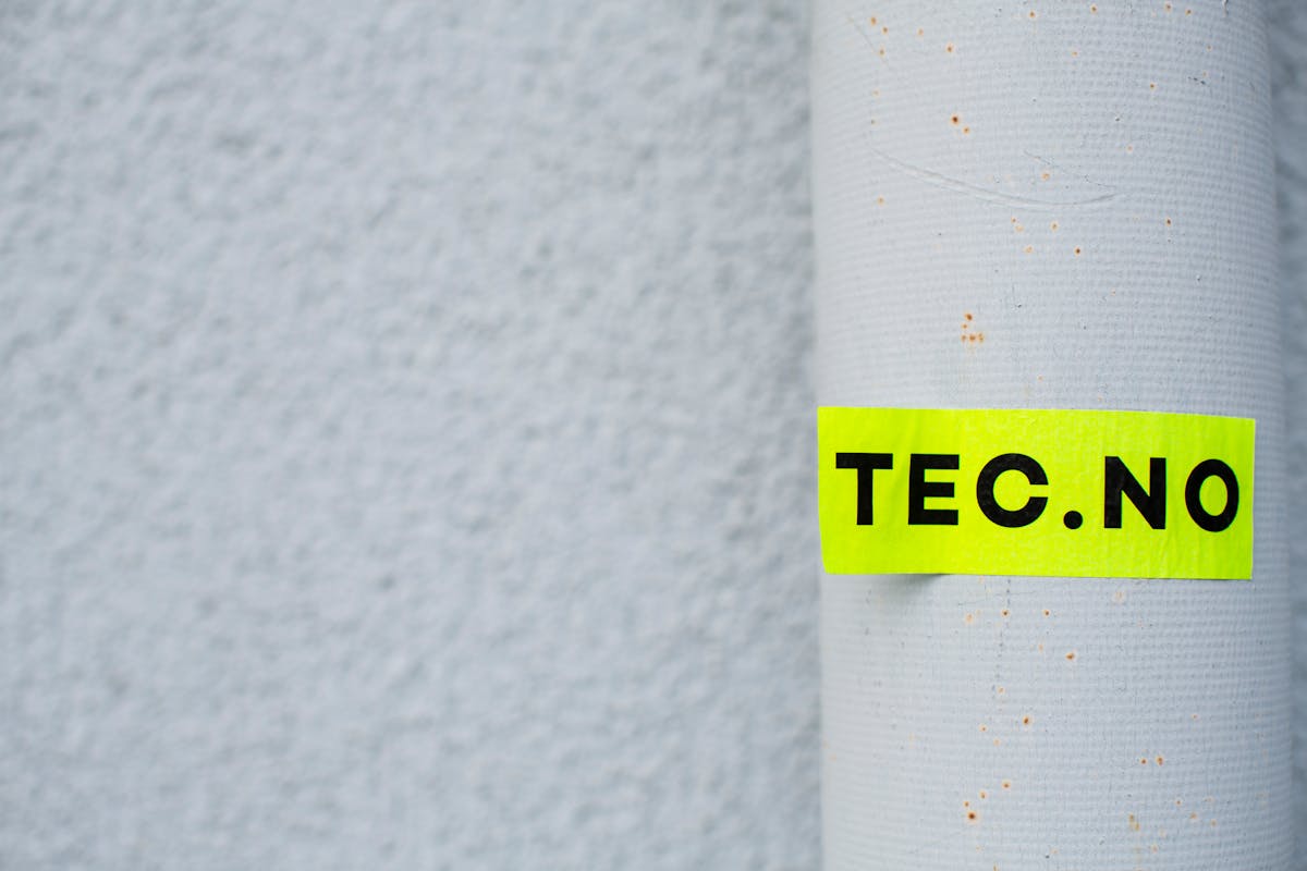 A close-up of an industrial label showing identification text.