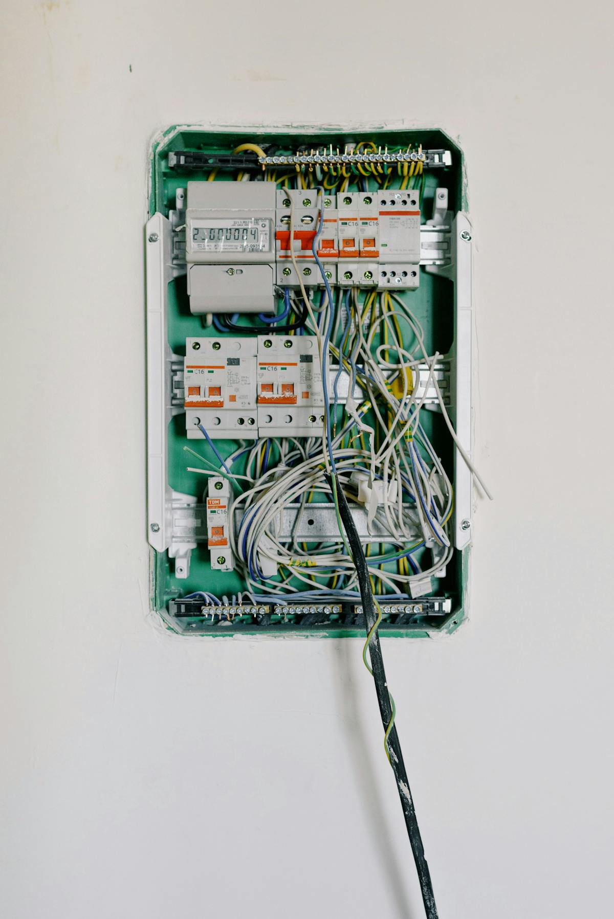 A panel of organized electrical components and breakers.